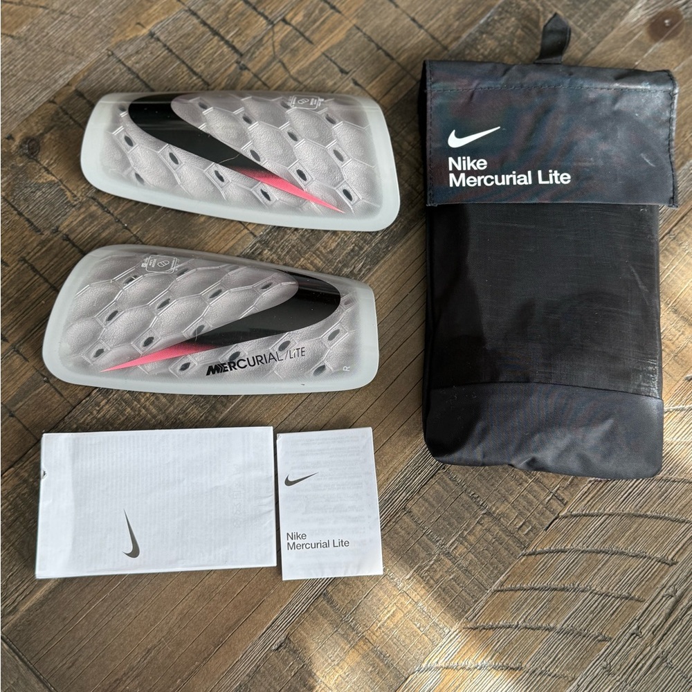 Nike Mercurial Lite Shin Guards in Black and White. Size medium. Smoke free home